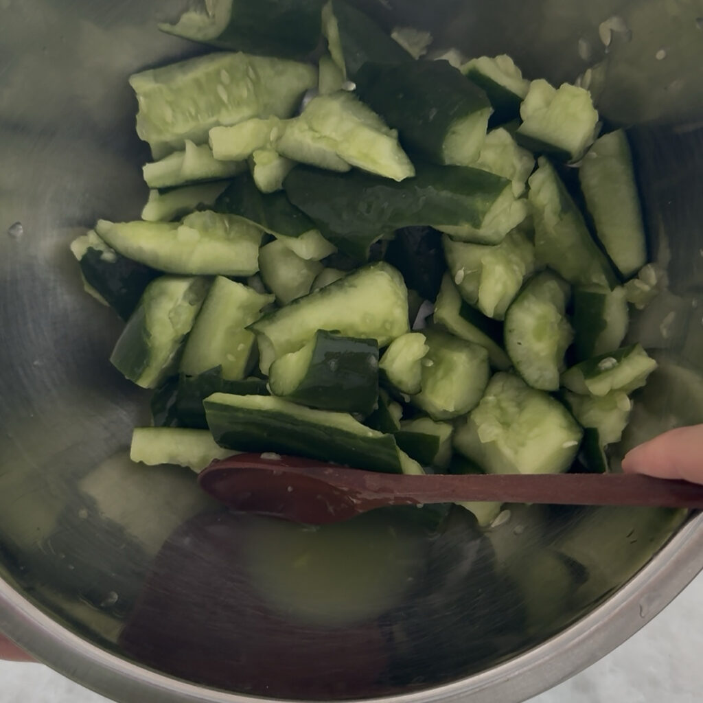 Smashed Cucumber Salad Draining excess water from cucumbers for Korean smashed cucumber salad