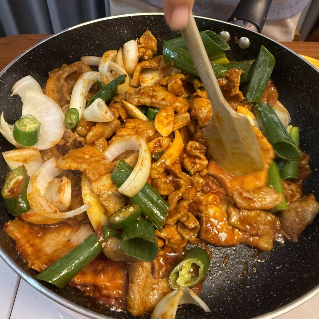Korean spicy pork (Jeyuk Bokkeum) stir-fried with onions and green onions.