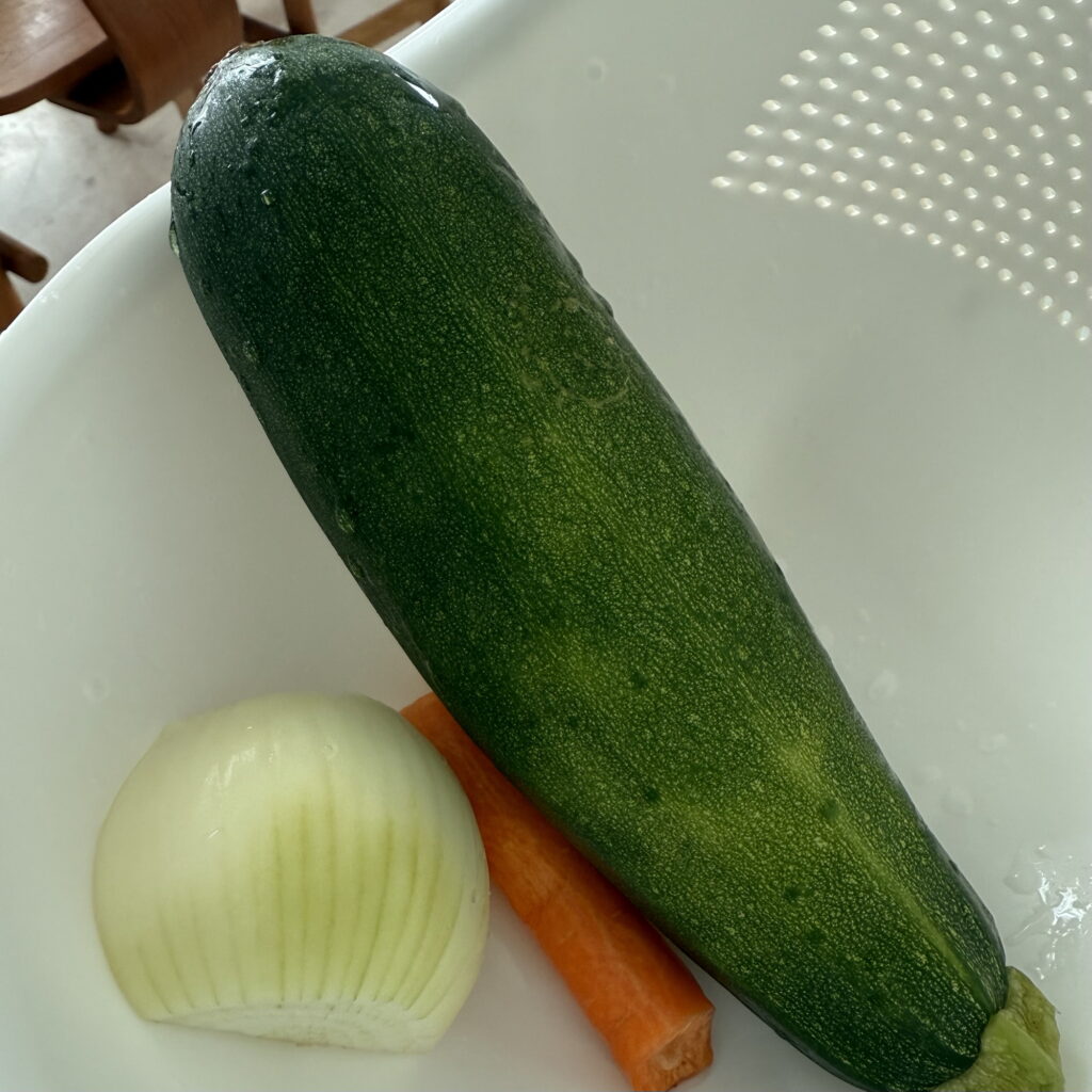 Fresh zucchini, onion, and carrot for making Crispy Korean Zucchini Pancake (Hobak Jeon).