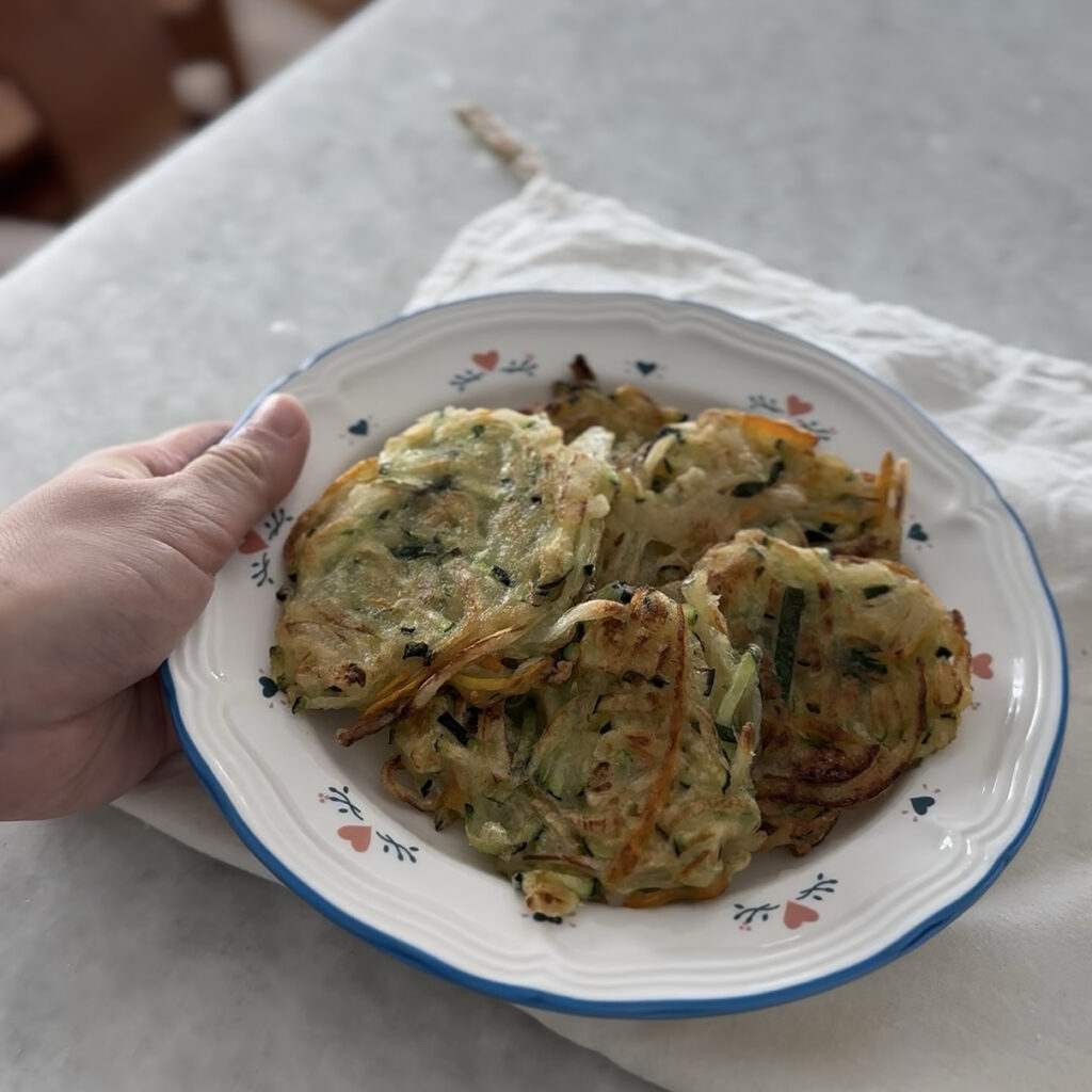 Crispy Korean zucchini pancake (Hobak Jeon) made with fresh zucchini, onion, and carrot, pan-fried until golden brown.