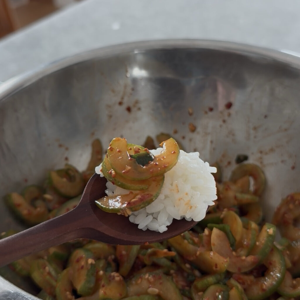 Korean cucumber salad served with warm rice