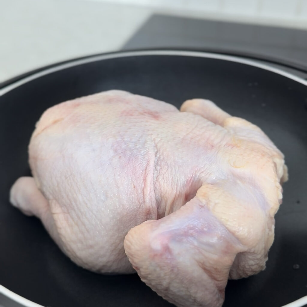 Whole chicken in a pot.
