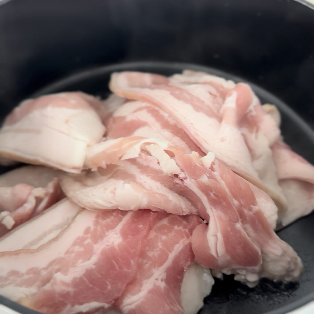 

Pork browning in a pot for Kimchi Jjigae
