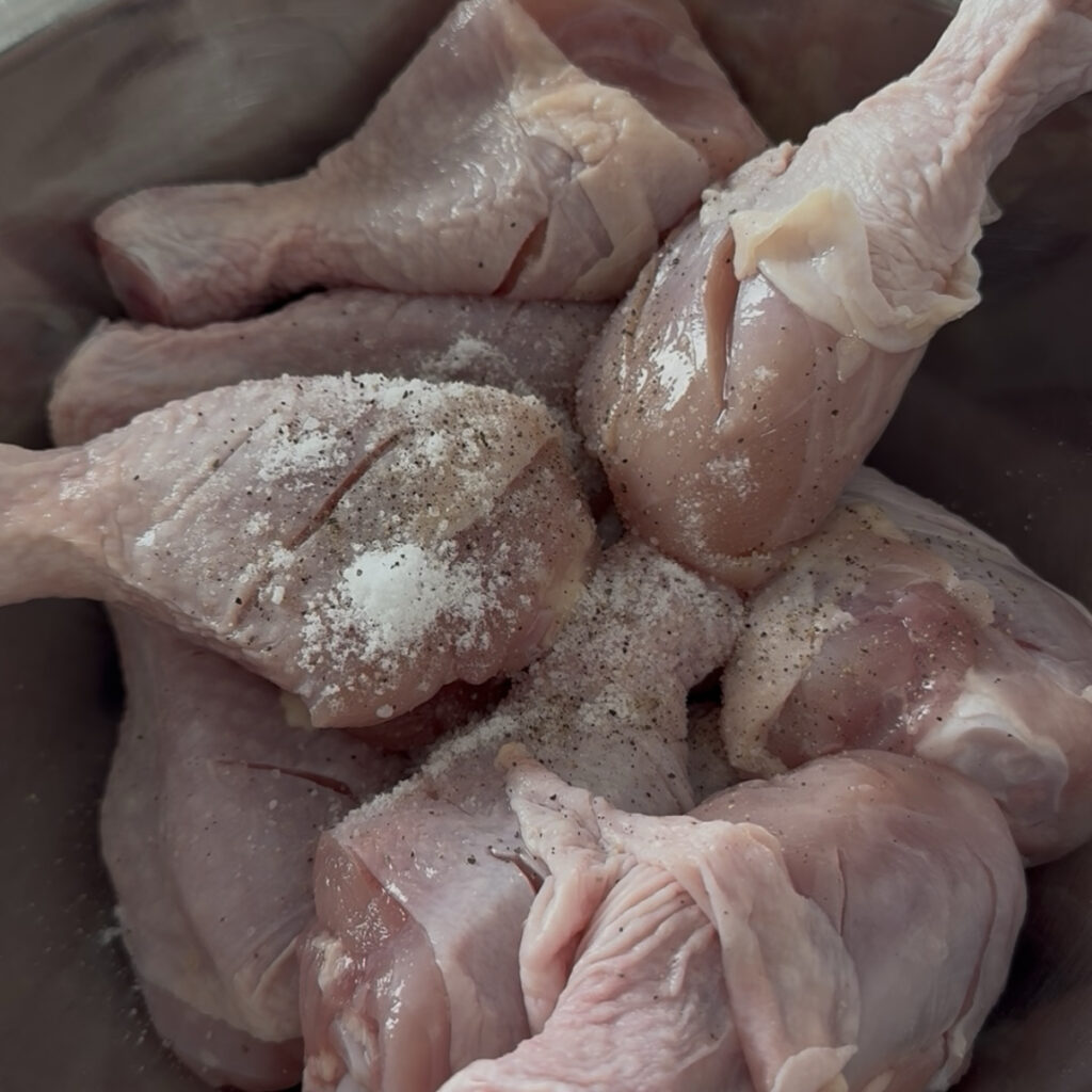 Chicken drumsticks seasoned with salt and black pepper