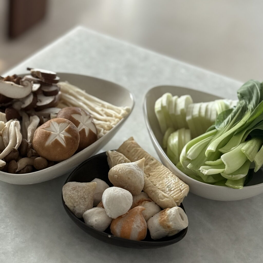 Ingredients for homemade Korean shabu shabu arranged before cooking.