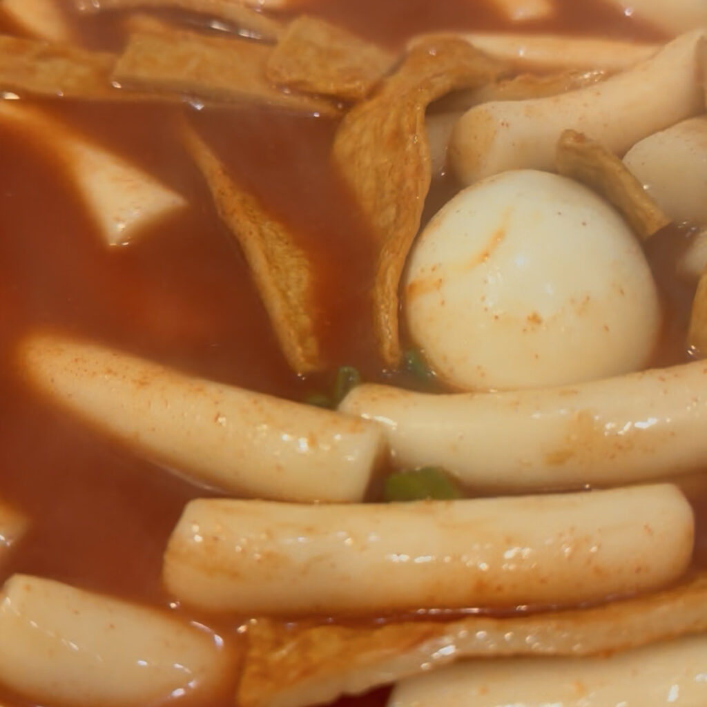 Homemade spicy tteokbokki sauce cooking in a pan