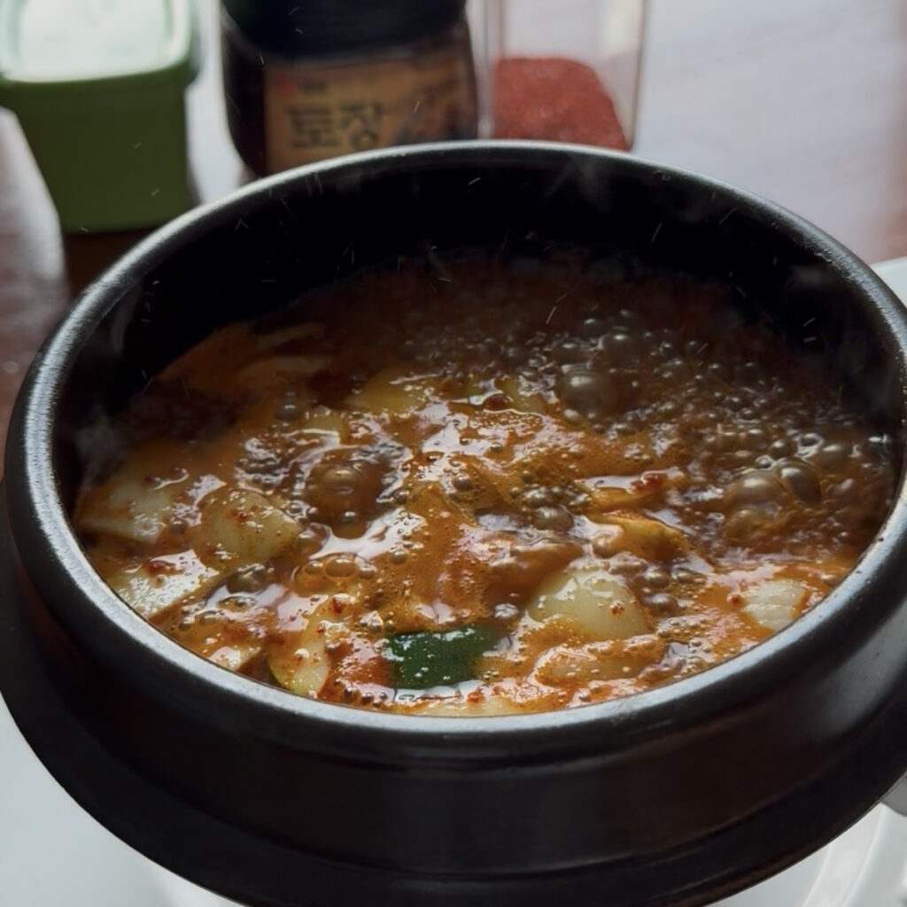 Hot doenjang jjigae simmering in a pot