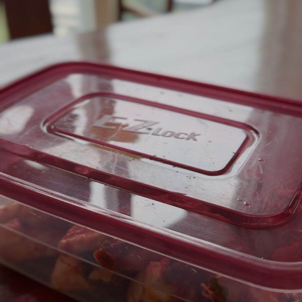 Chonggak kimchi in a container ready to ferment