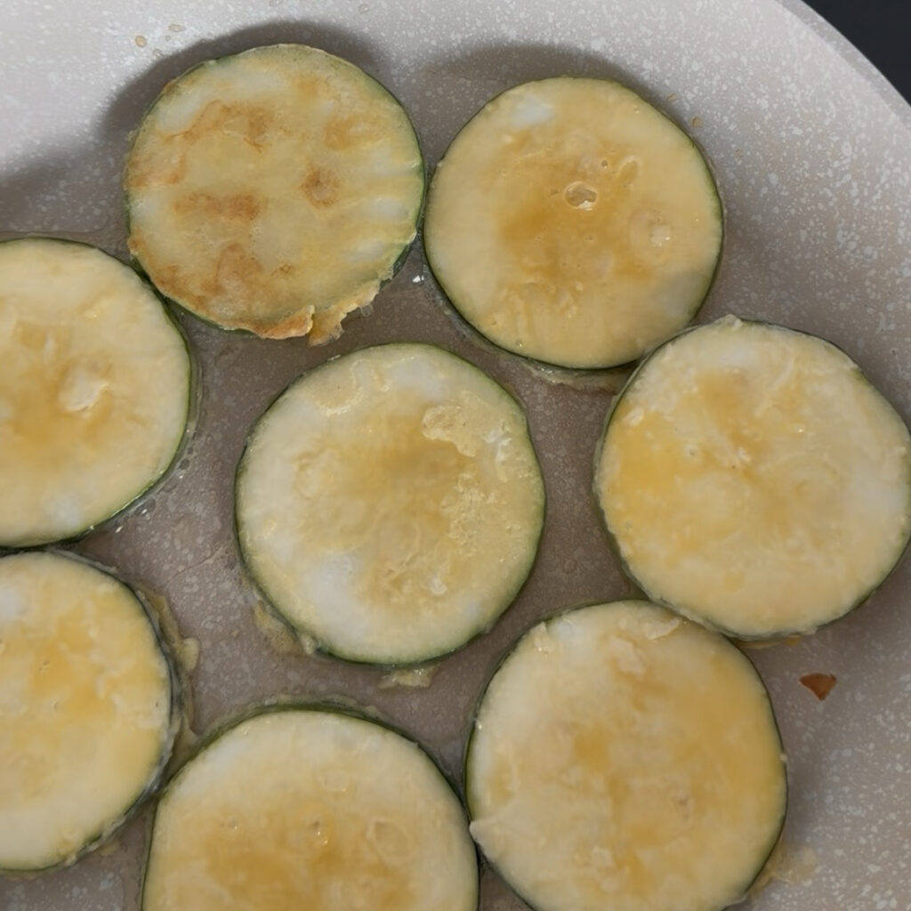 Pan-frying zucchini pancakes in a nonstick skillet